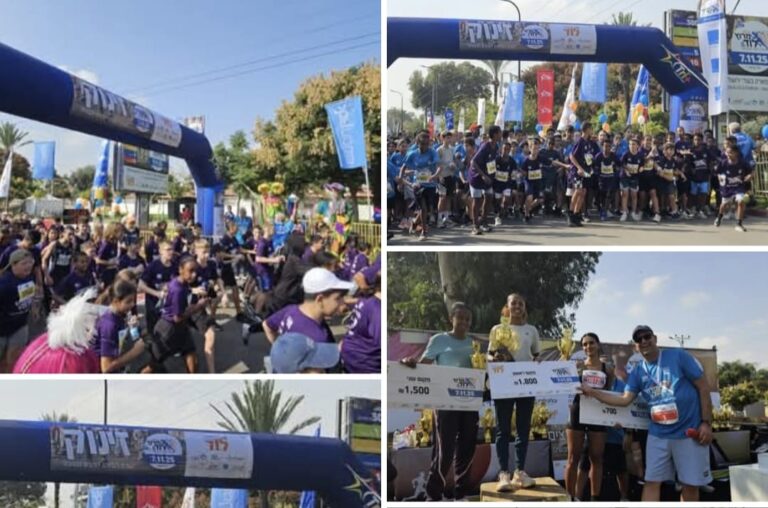 אלפי רצים בחולצות צבעוניות חוצים את קו הסיום ברחוב המרכזי בלוד, מוזיקה באוויר וקהל שמריע מהצדדים.